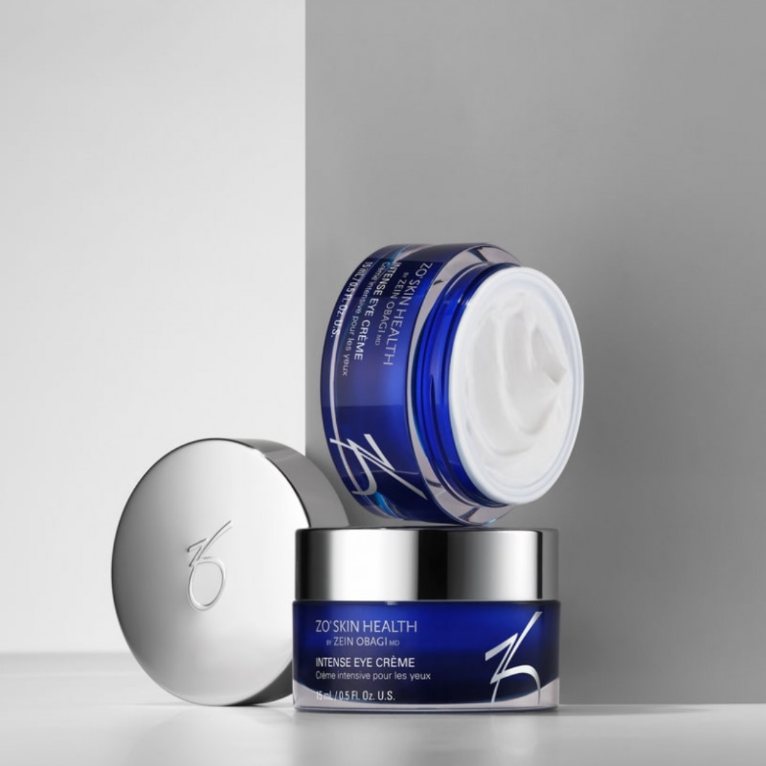 Blue jar of ZO Skin Health Intense Eye Creme with open lid showing white cream texture.