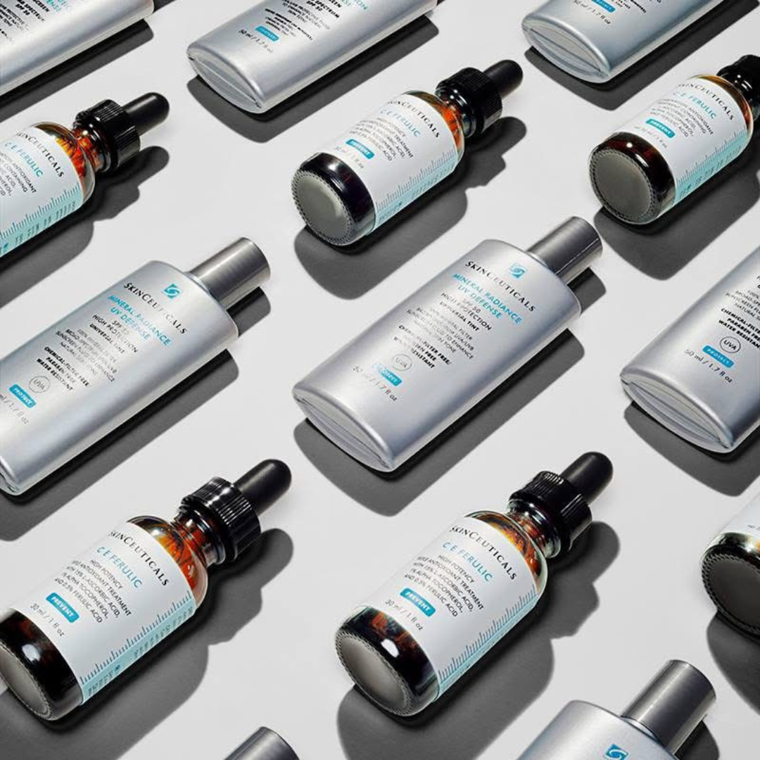 Skinceuticals skincare products including CE Ferulic serum and Mineral Radiance UV Defense sunscreen bottles on white background