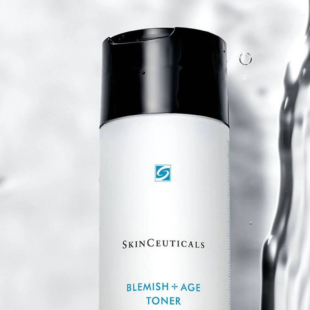 SkinCeuticals Blemish + Age Toner bottle with black cap and water splash background