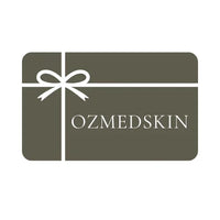 Ozmedskin gift card with white bow on olive green background for skincare products