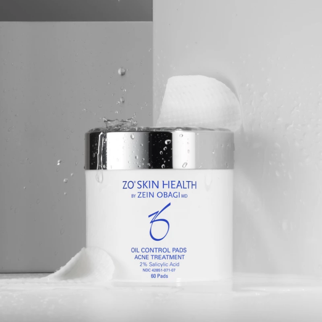 ZO Skin Health Oil Control Pads acne treatment jar with water splashes and textured pads