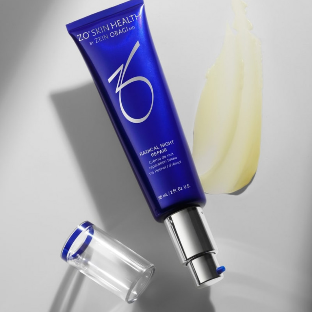 Blue tube of ZO Skin Health Radical Night Repair cream with silver pump and cream smear